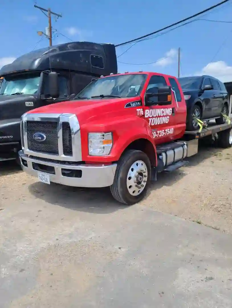 Bouncing Towing LLC tow truck fleet at Dallas yard
